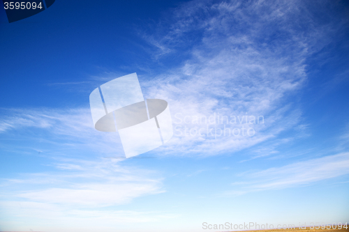 Image of the sunrise in  colored sky white soft clouds and abstract backg