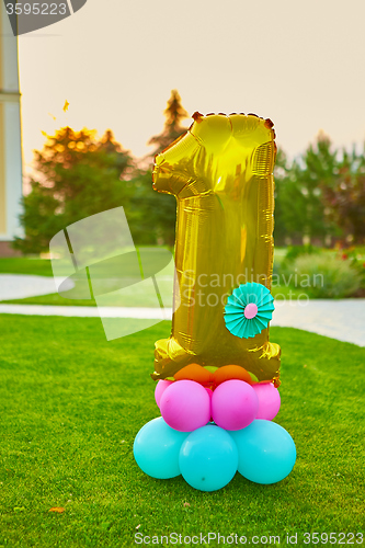 Image of Golden number 1 made of inflatable balloon