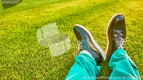 Image of Man relaxing, enjoying landscape on sunny day - point of view