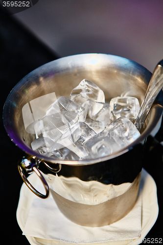 Image of Close up ice in metal bucket