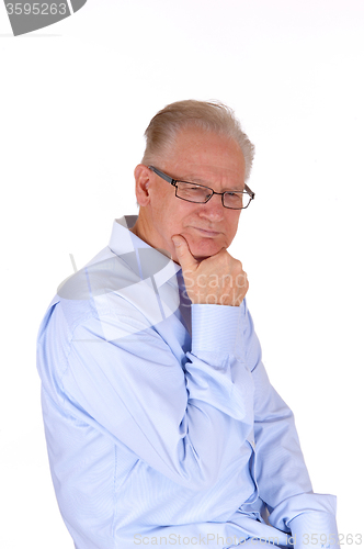 Image of Mature man sitting and thinking.