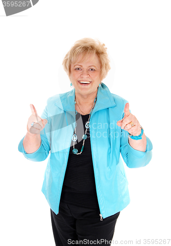 Image of Happy mature woman with thumbs up.