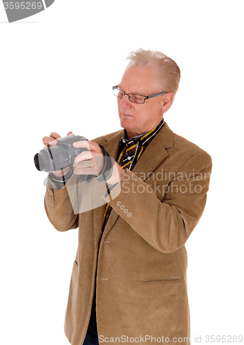 Image of Middle age man taking pictures.