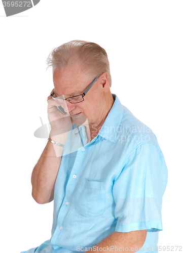 Image of Middle age man on cell phone.