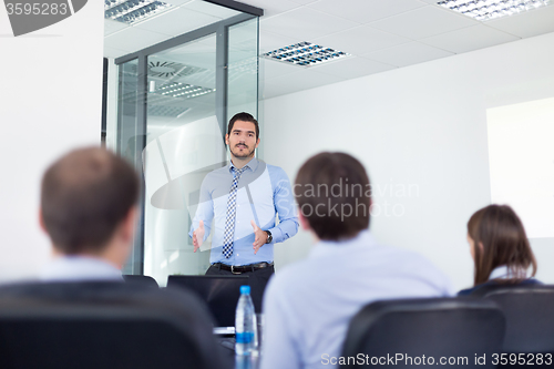 Image of Business man making presentation in office on job interview. 