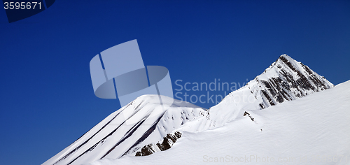 Image of Panoramic view on off-piste slope and blue clear sky in nice day