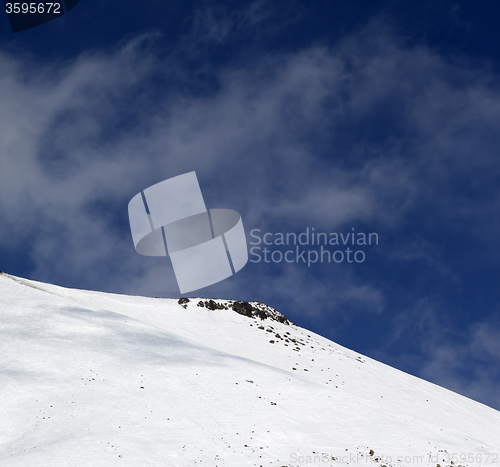 Image of Off-piste slope with stones at windy day