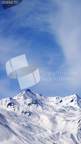 Image of Winter snowy mountains at windy day