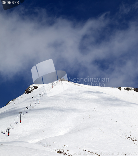 Image of Ski slope and ropeway at sunny winter day