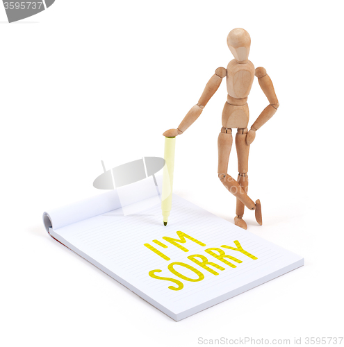 Image of Wooden mannequin writing - I\'m sorry