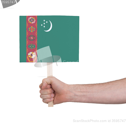 Image of Hand holding small card - Flag of Turkmenistan