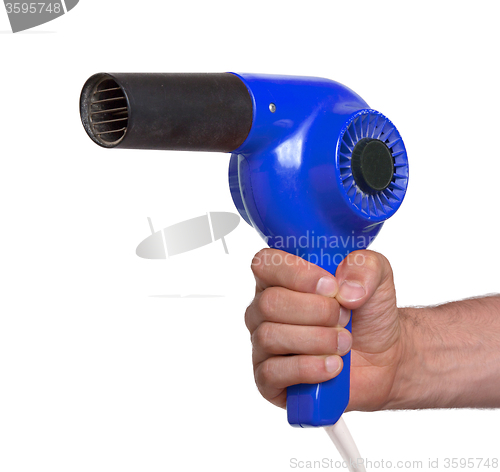 Image of Old blue hairdryer in hand