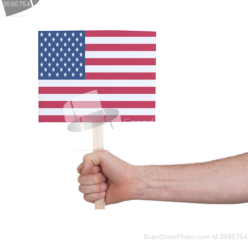 Image of Hand holding small card - Flag of the USA