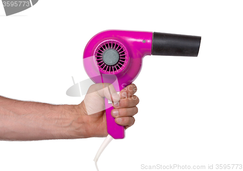 Image of Old pink hairdryer in hand