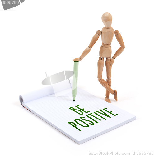 Image of Wooden mannequin writing - Be positive