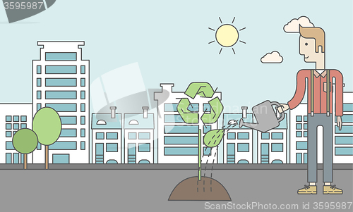 Image of Man watering tree.