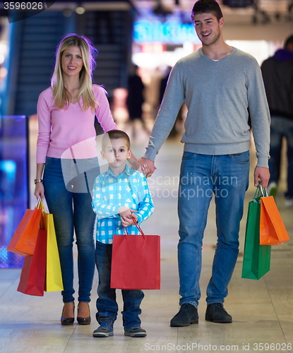 Image of young family with shopping bags