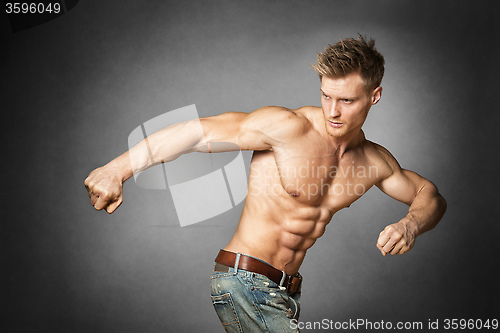 Image of Athlete in denim trousers