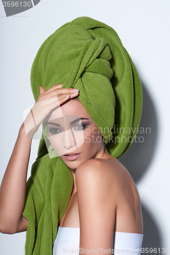 Image of Woman with smokey makeup and green turban