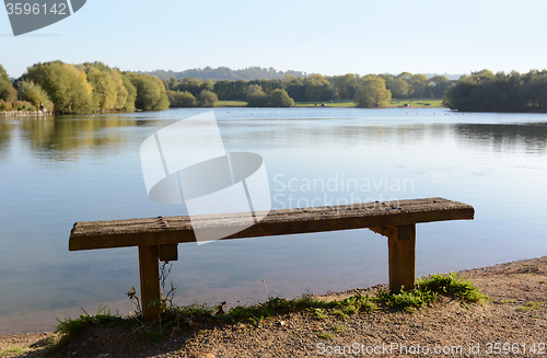 Image of Rustic bench by a lake