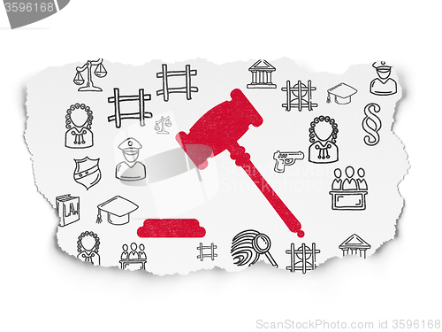Image of Law concept: Gavel on Torn Paper background