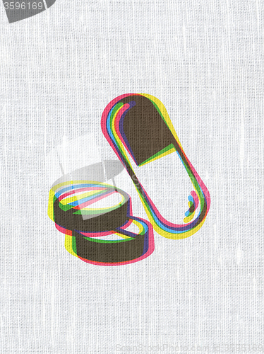 Image of Healthcare concept: Pills on fabric texture background