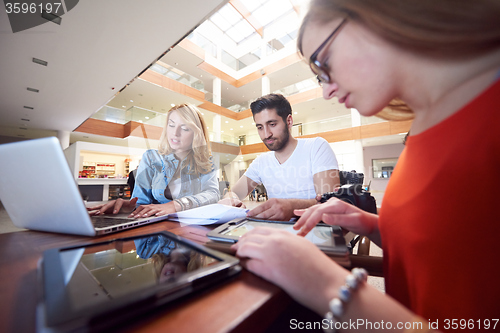Image of students group working on school  project  together