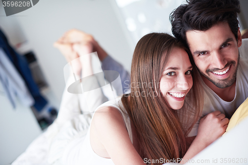 Image of couple relax and have fun in bed