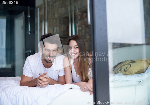 Image of couple relax and have fun in bed