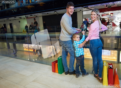 Image of young family with shopping bags