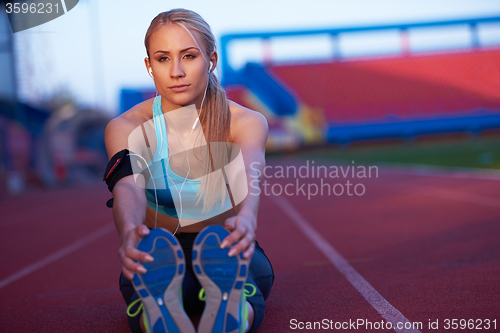 Image of sporty woman on athletic race track