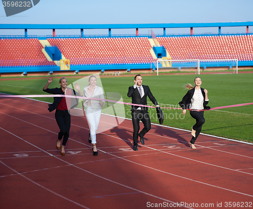 Image of business people running on racing track