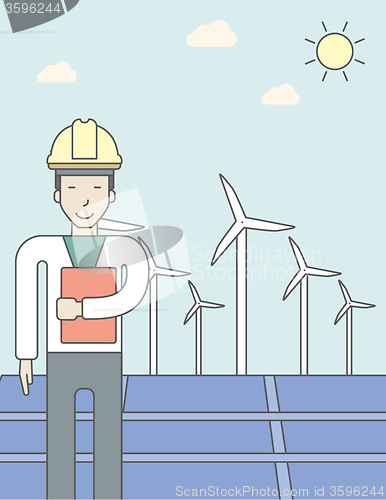 Image of Man with solar panels and wind turbines.