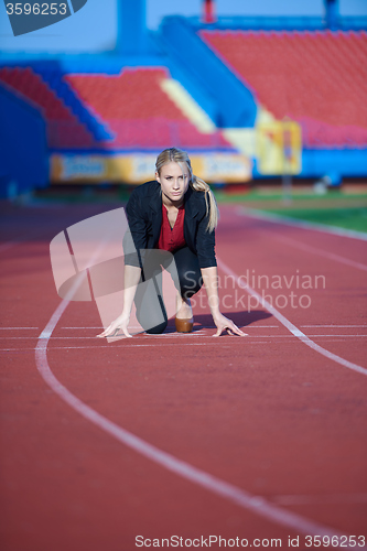 Image of business woman ready to sprint