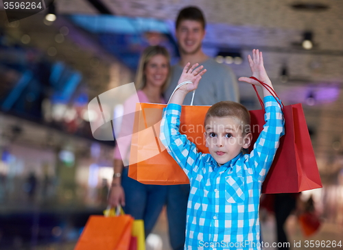 Image of young family with shopping bags
