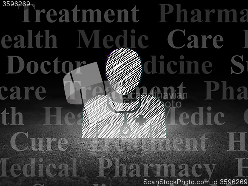 Image of Health concept: Doctor in grunge dark room