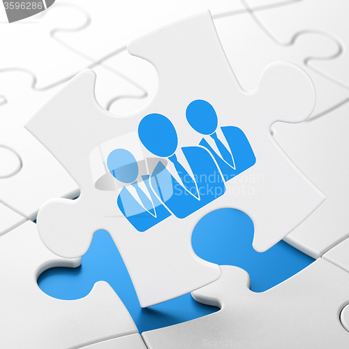 Image of Finance concept: Business People on puzzle background