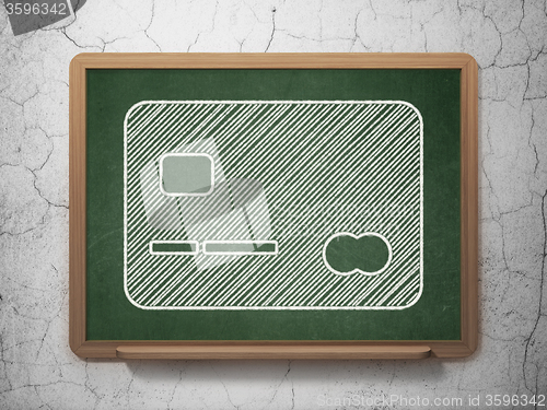 Image of Money concept: Credit Card on chalkboard background