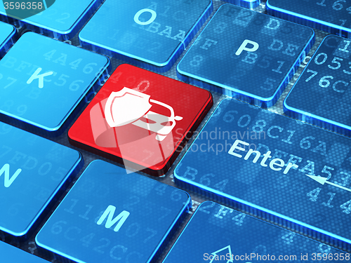 Image of Insurance concept: Car And Shield on computer keyboard background