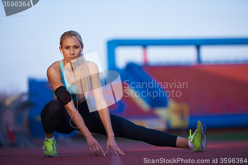 Image of sporty woman on athletic race track
