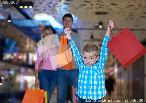 Image of young family with shopping bags