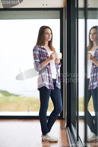 Image of relaxet young couple drink first morning coffee