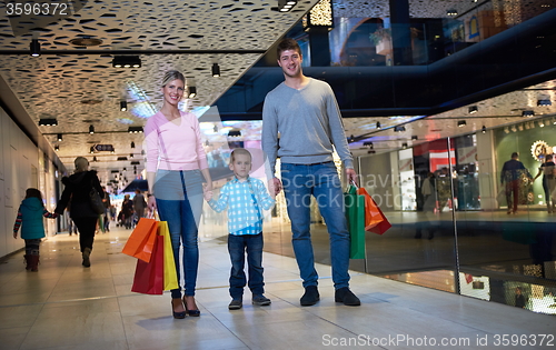 Image of young family with shopping bags