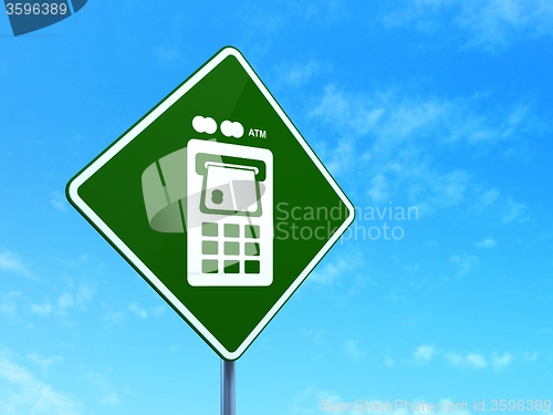 Image of Banking concept: ATM Machine on road sign background