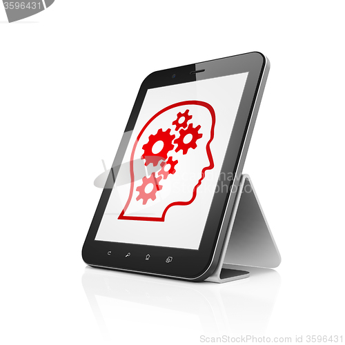 Image of Data concept: Tablet Computer with Head With Gears on display