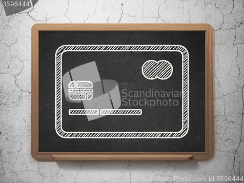 Image of Money concept: Credit Card on chalkboard background