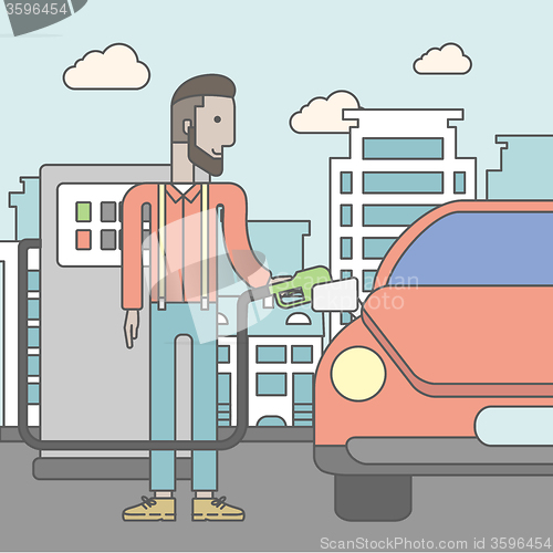 Image of Man filling up fuel into car.