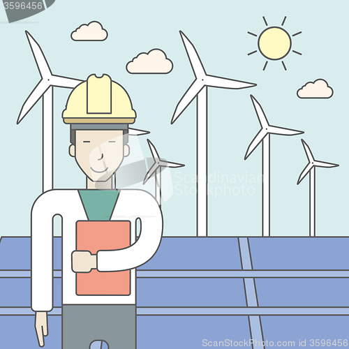 Image of Man with solar panels and wind turbines.