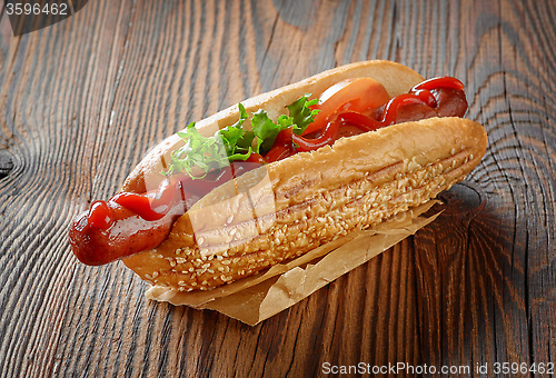 Image of Hot dog on wooden table