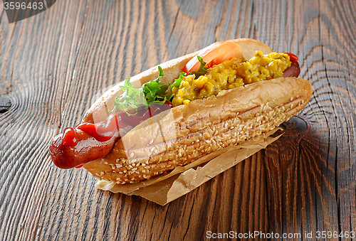 Image of Hot dog on wooden table